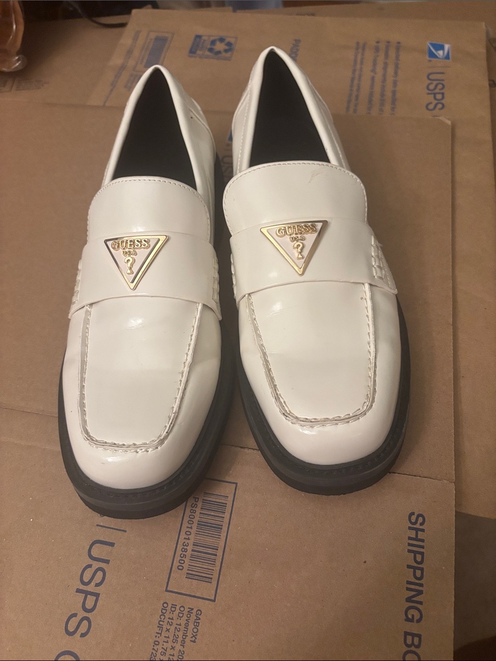 NWOT Guess White Slip-On Penny Loafers with Gold Triangle Logo